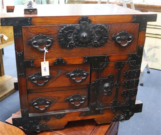 A Japanese style iron mounted wheeled chest, tansu, W.74cm